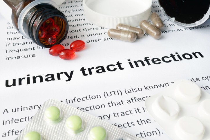 A doctor explains the causes of frequent urinary tract infections to a concerned woman, addressing the common question 'Why do I get UTIs so often?'