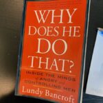 Book cover of Why Does He Do That? by Lundy Bancroft, a popular book on domestic abuse, critically reviewed in this article.