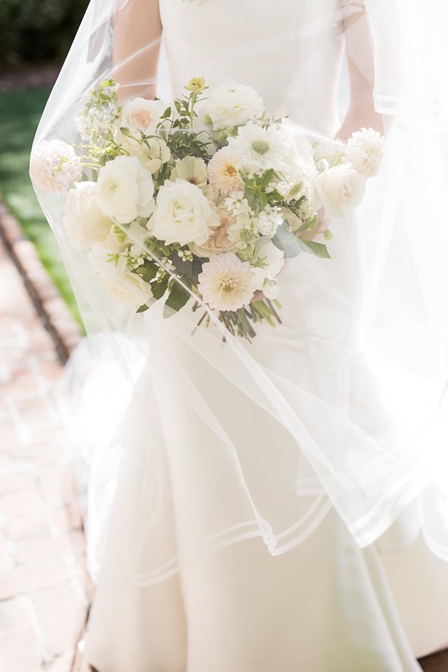 Candid moment of a bride and groom during their William Aiken House wedding, captured in true-to-life colors.