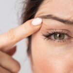 Close-up of a woman's eye twitching, emphasizing the involuntary muscle spasm