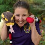 CobraCaroline engaging preschoolers with a snake puppet show, making learning fun and accessible