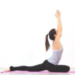 Diverse group stretching outdoors, illustrating the feel-good sensation and benefits of stretching for overall well-being.