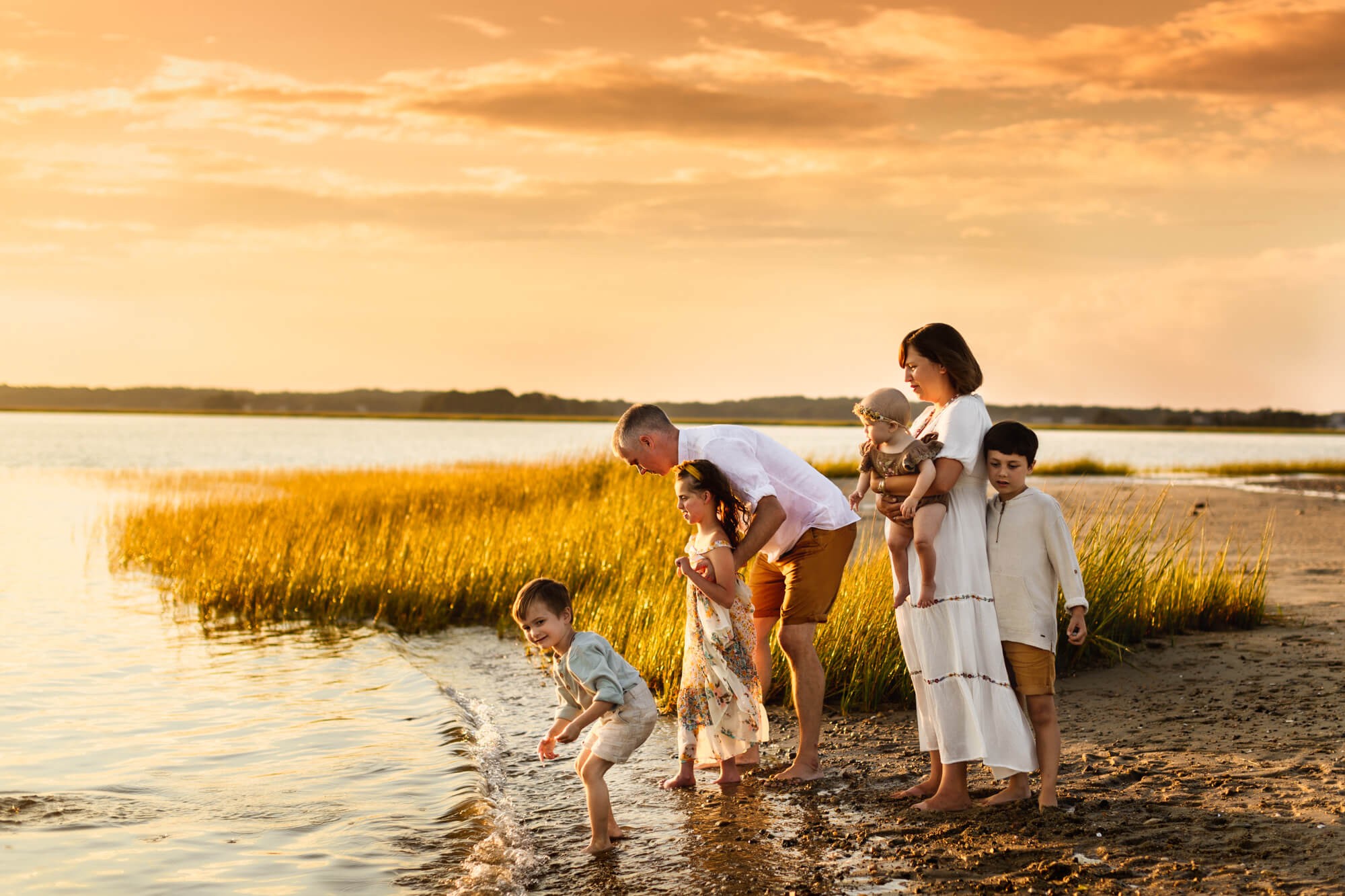 Duxbury Beach Family Photo Session - Family walking on the beach during golden hour