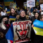 Global Protest Against Russia's War in Ukraine: Demonstrators in Istanbul holding Ukrainian flags and signs condemning the invasion.