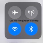 iPhone Control Center showing Cellular Data highlighted as ON, suggesting users might need to turn it OFF to fix AirDrop issues.