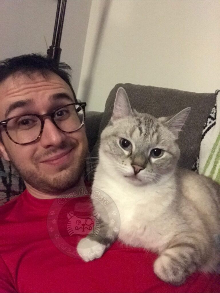 Joey and Zoloft the cat sitting together.