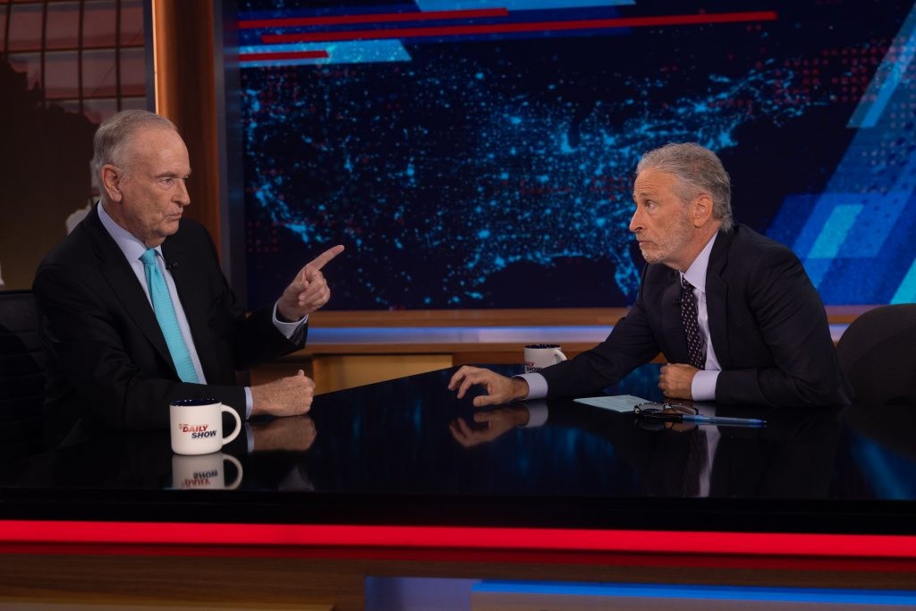 Jon Stewart of The Daily Show interviewing Bill O'Reilly, referencing the cancellation of their Milwaukee shows during the Republican National Convention.