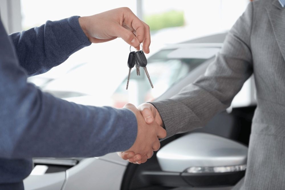 Man looking to buy a used car at a dealership