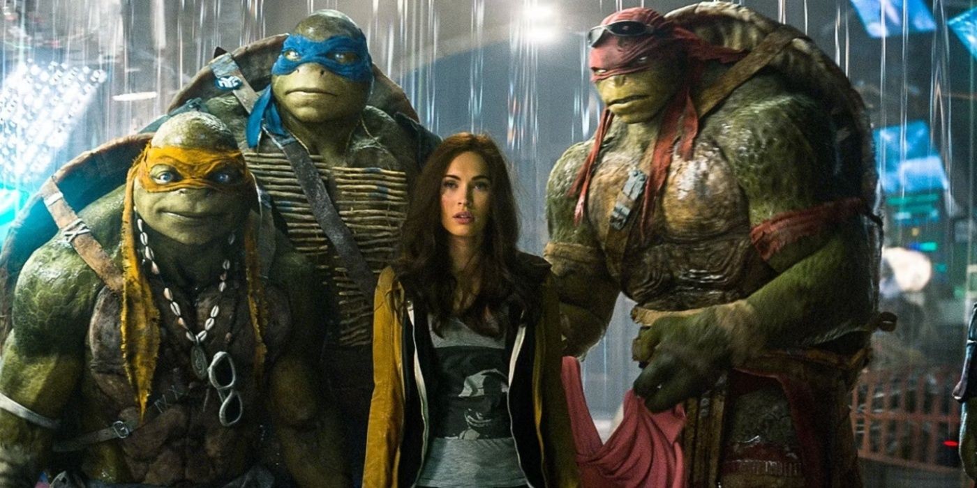 Megan Fox as April with the turtles in Teenage Mutant Ninja Turtles.