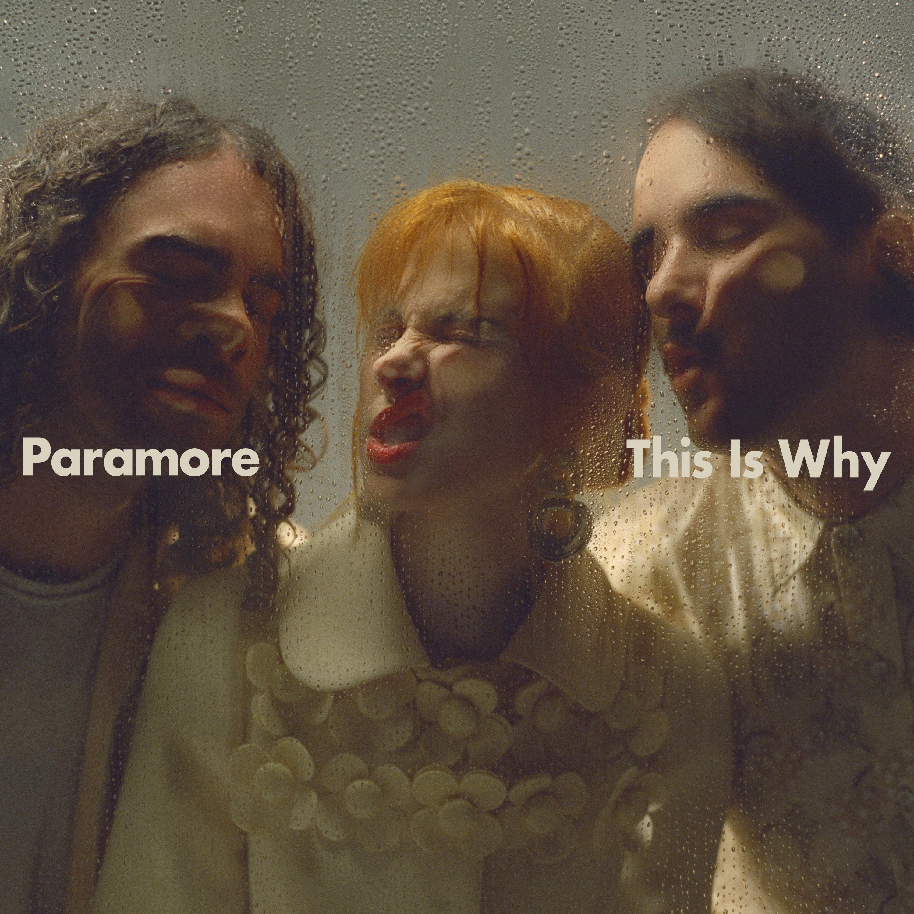 Paramore's "This Is Why" album cover featuring the band members faces pressed against a glass pane