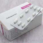 photo of a box of generic gabapentin pills, with a full blister pack containing 10 pills resting on top