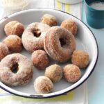 Pile of apple cider doughnuts on a plate