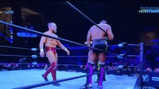 Pixelated image of wrestlers on Sling TV, highlighting poor stream quality