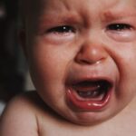 portret of a baby screaming and crying