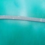 Scenic view of a highway stretching across the blue ocean, illustrating the natural color of deep ocean water due to light absorption.