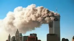 Smoke plumes billowing from the Twin Towers of the World Trade Center in New York City