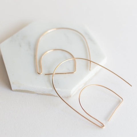 Stella geometric earrings on model