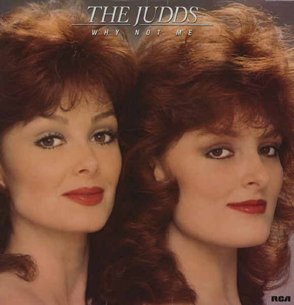 The Judds Why Not Me album cover featuring Naomi and Wynonna Judd smiling and posing with guitars