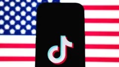 TikTok logo displayed on a smartphone screen, illustrating the app facing a potential ban in the United States due to national security concerns.