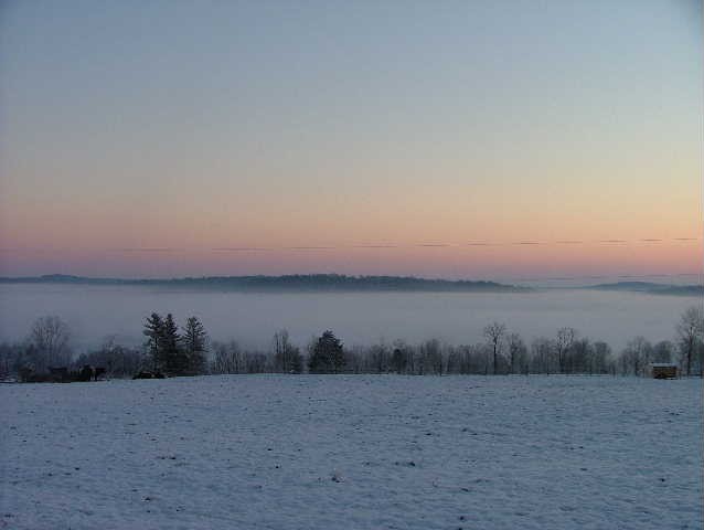 Valley fog in Harrison County, Indiana, showcasing dense ground-level cloud cover due to nighttime cooling.