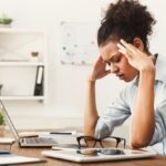 Worried woman experiencing a throbbing headache everyday. Understanding the causes and types of daily headaches can help manage the pain and know when to seek medical advice.