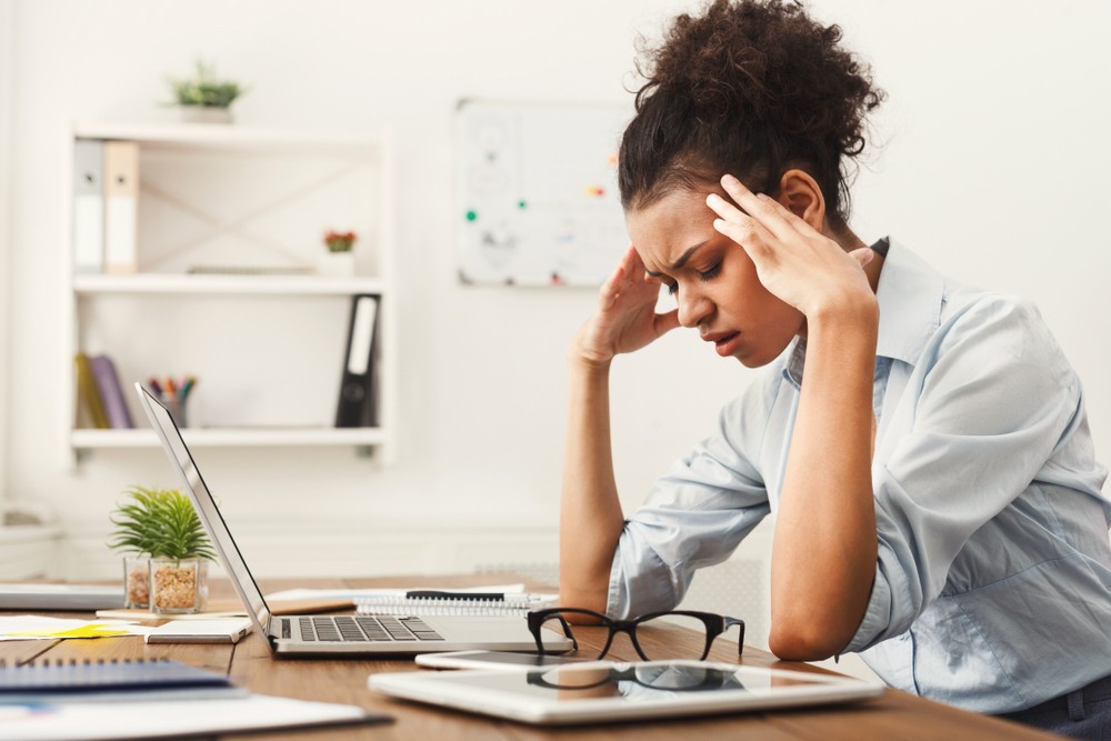 Worried woman experiencing a throbbing headache everyday. Understanding the causes and types of daily headaches can help manage the pain and know when to seek medical advice.