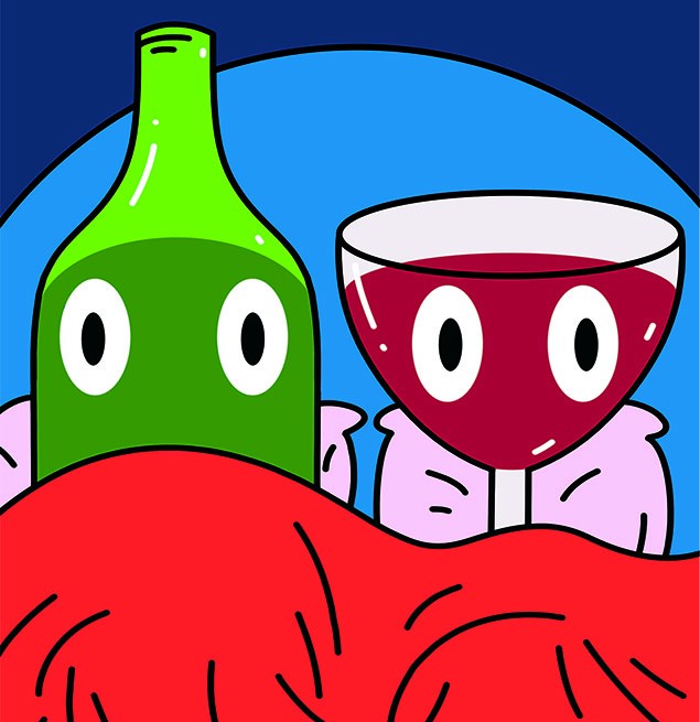 Wine bottle and glass in bed