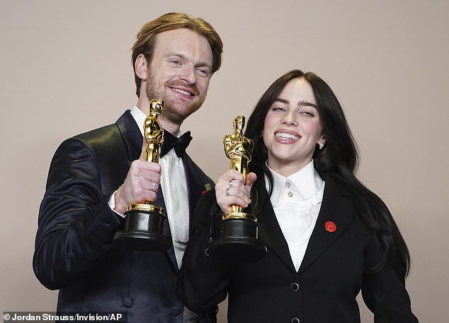 Finneas and Billie Eilish performing together on stage, showcasing their collaborative bond
