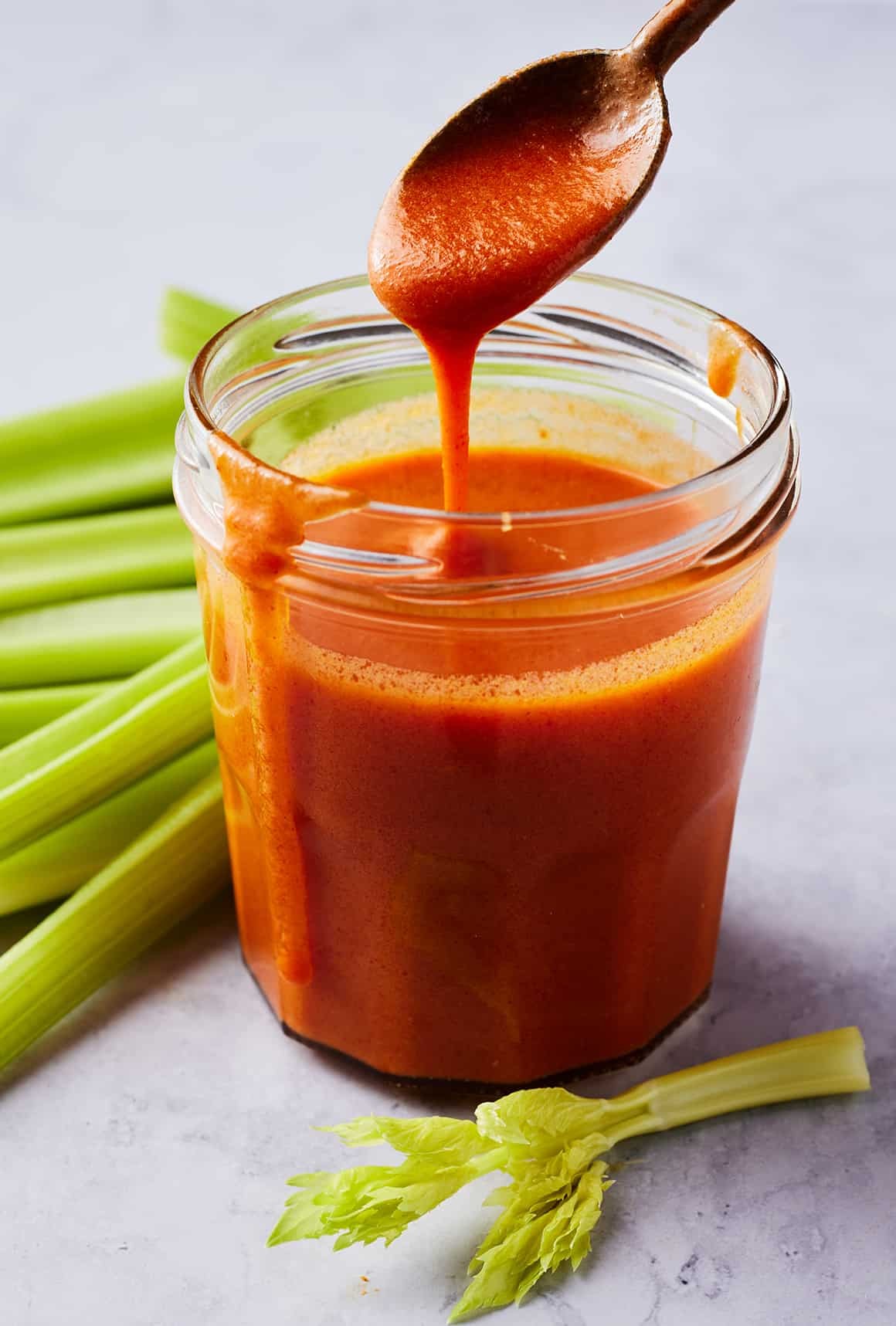 Close-up of homemade Buffalo sauce in a small glass bowl