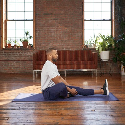 Man doing seated hamstring stretch