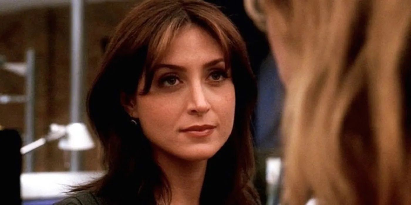 Sasha Alexander as Kate Todd smiling on NCIS, a reminder of her vibrant presence on the show and the potential for flashback appearances
