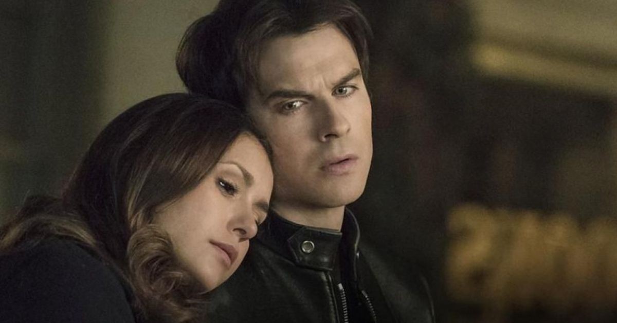 Nina Dobrev and Ian Somerhalder share a candid moment on set, demonstrating their professionalism.