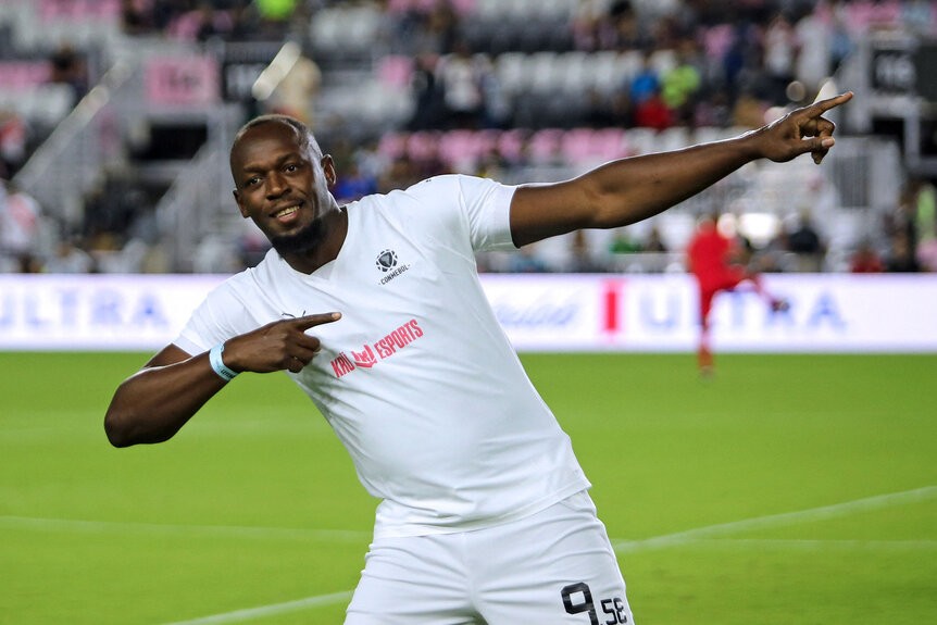 Usain Bolt gestures before the exhibition "Leyendas Conmebol" football match at DRV PNK Stadium in Fort Lauderdale, Florida, on December 5, 2023