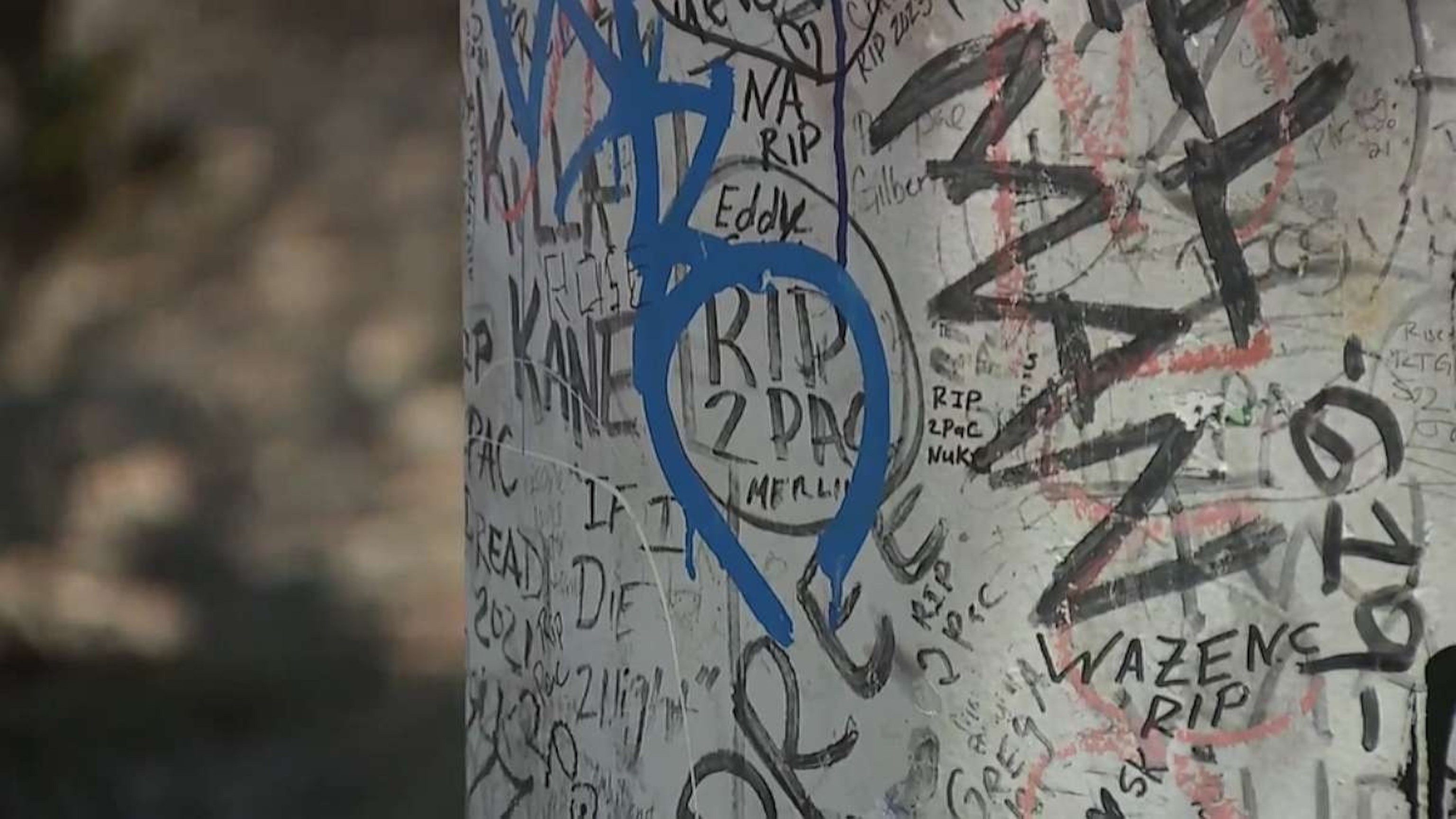 Memorials to Tupac Shakur stand near the intersection where he was fatally shot in Las Vegas, July 18, 2023.