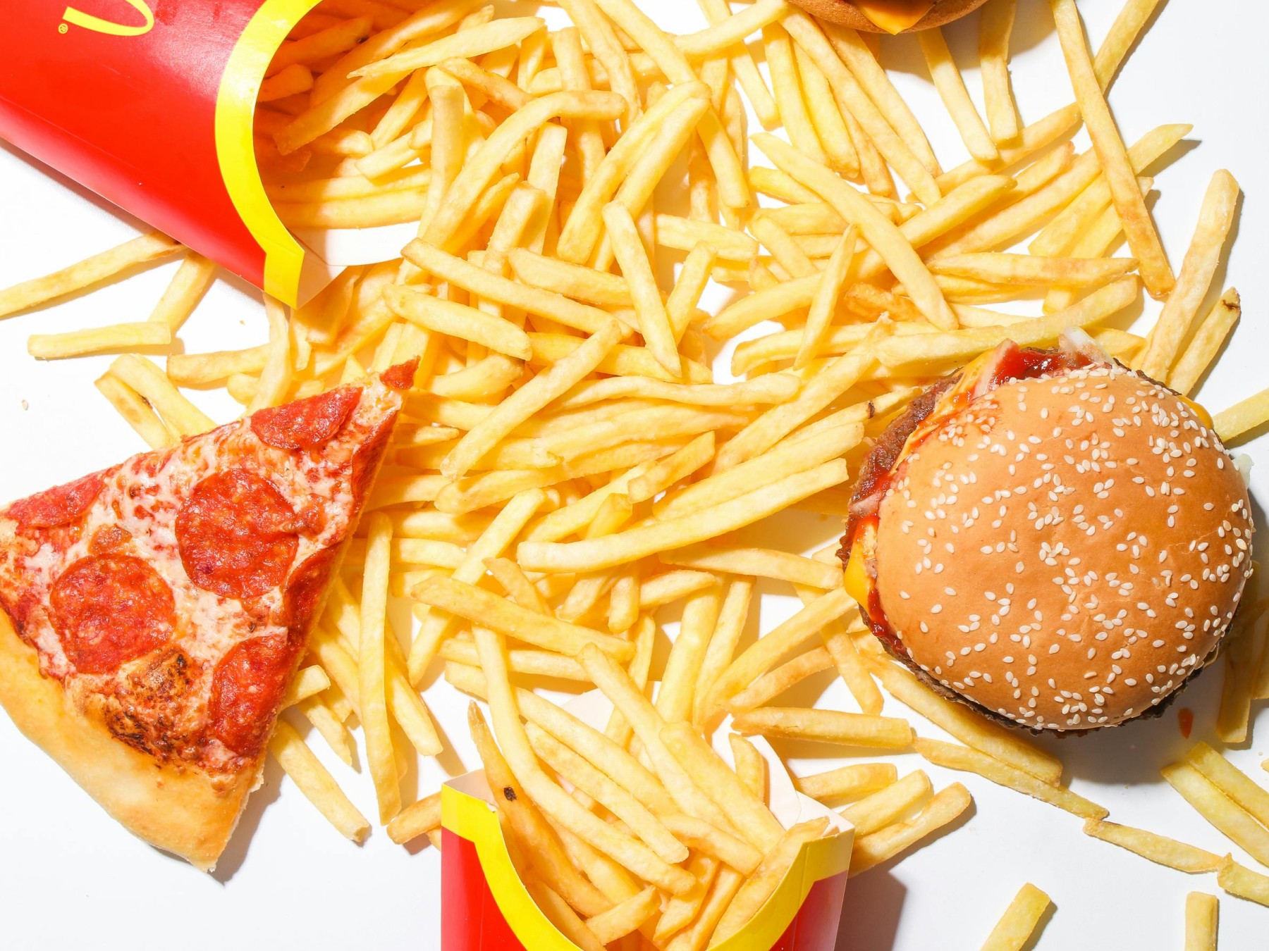Various fast food meals like pizza, burger, and fries